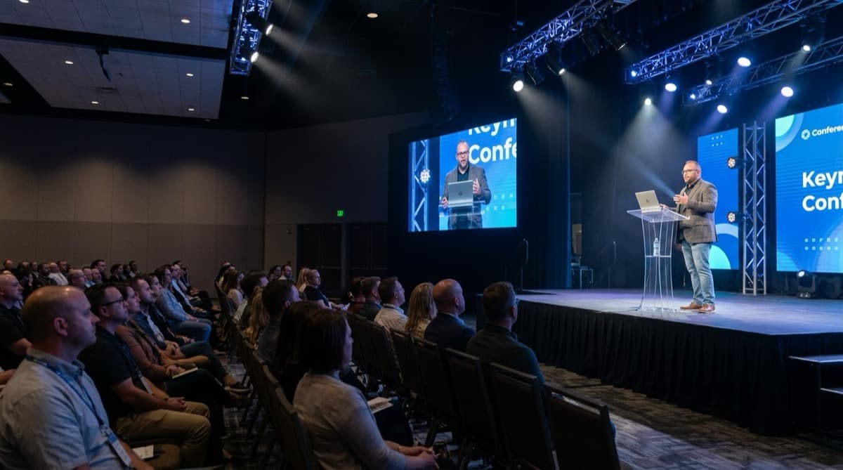 An AI generated illustration of Matt Aubin delivering a keynote in a conference hall.