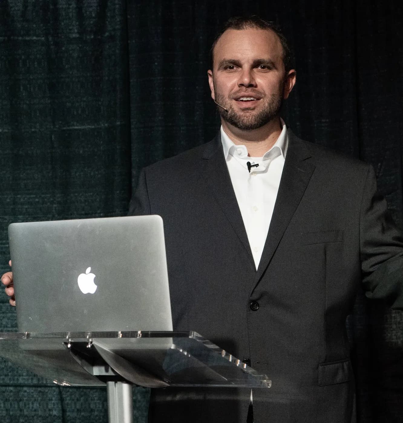 Matt Aubin speaking on stage